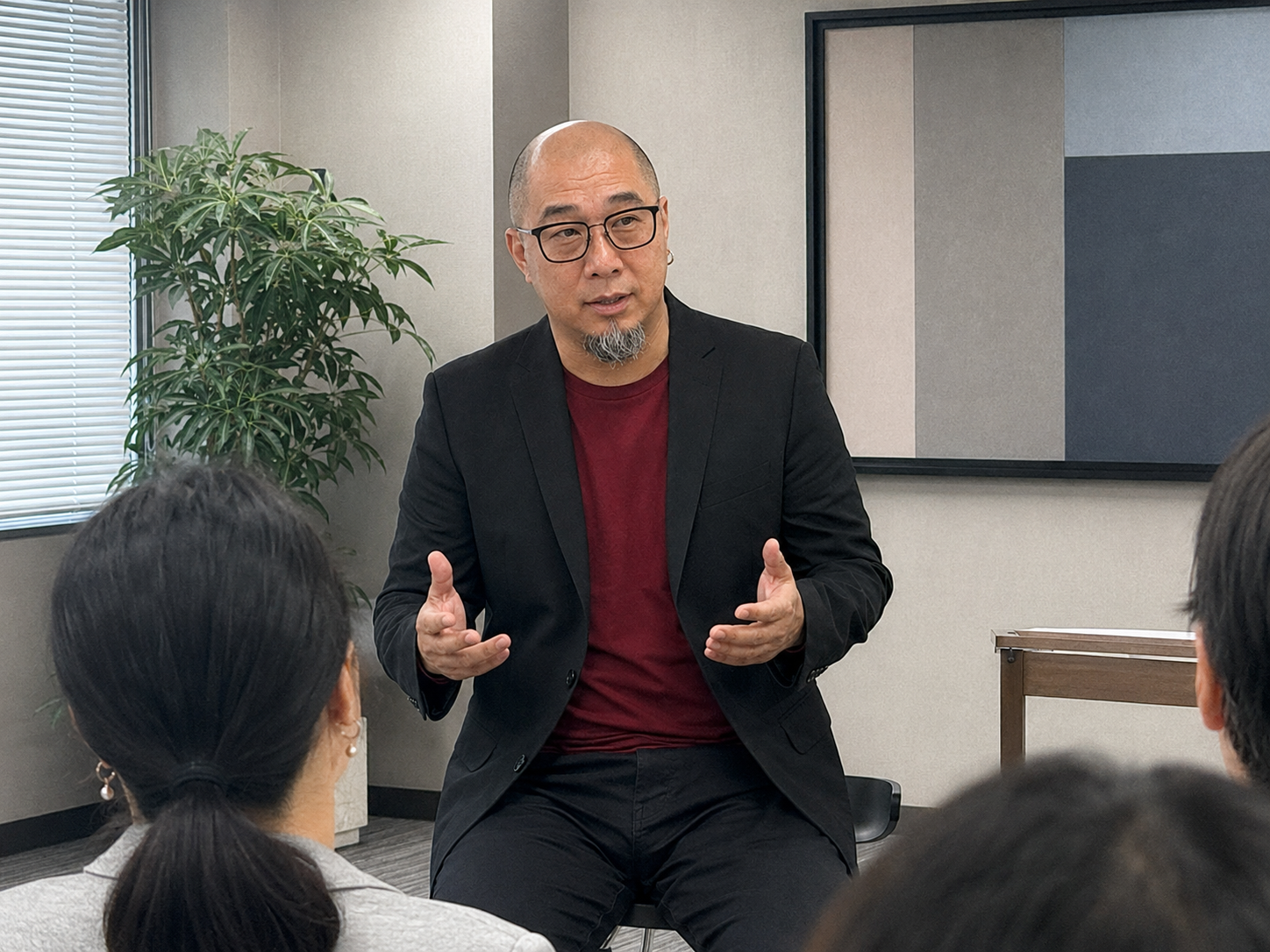 Martin Lim speaking with a small group