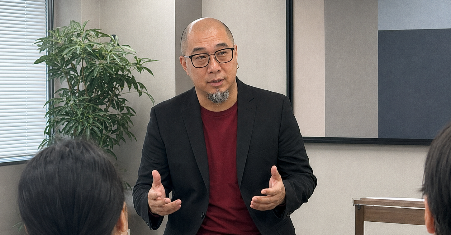 Martin Lim speaking with a small group